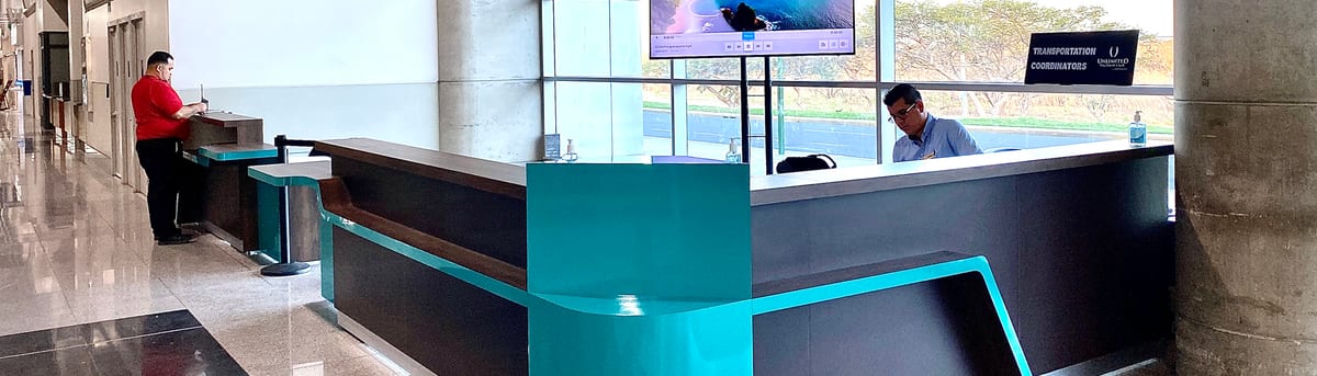 Custom UVC reception counter with a turquoise lit edge